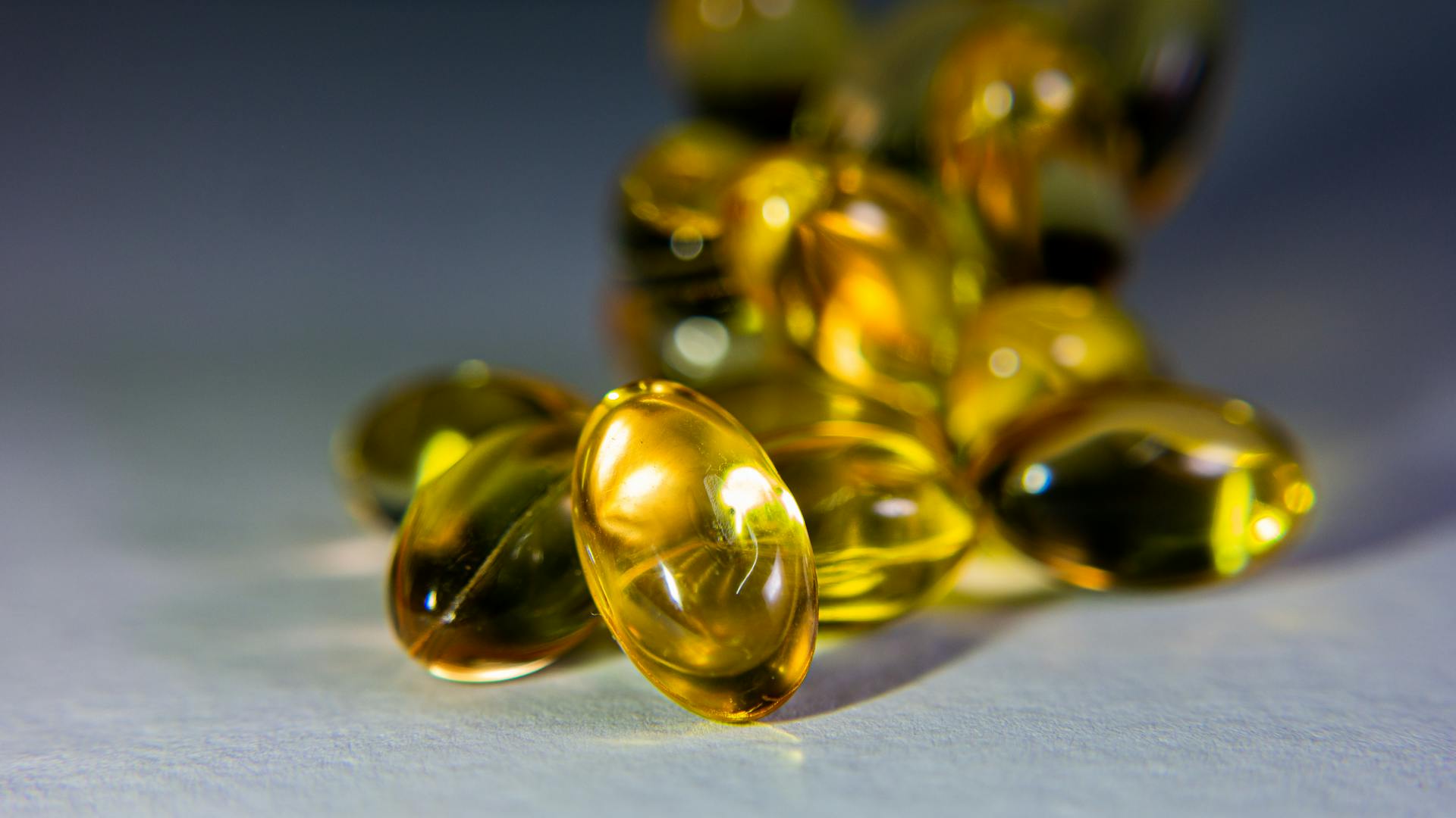 Golden softgel capsules exported from India to global markets — Admetus Lifesciences, WHO-GMP certified